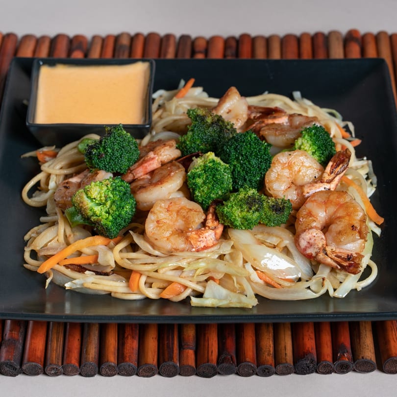 Sake Express shrimp and broccoli hibachi noodles with a side of yum yum sauce.